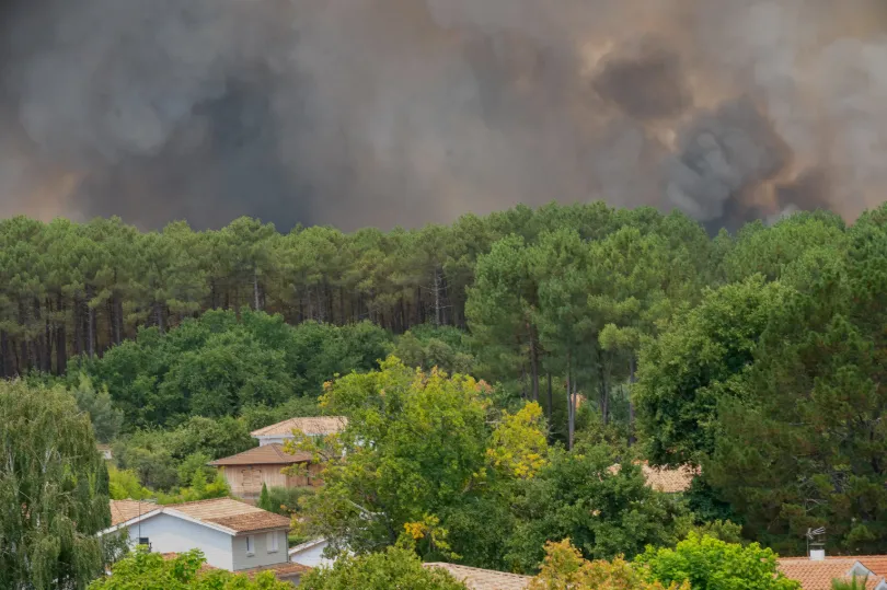 Smoke rises over wildfires in the Lège-Cap-Ferret region, western France,Thursday, July 23, 2026. (AP PhotoCaroline Blumberg)