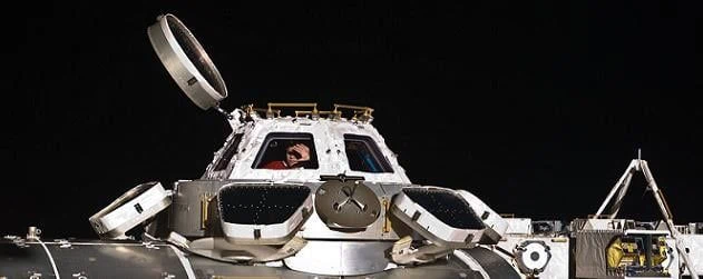 Crew replace pane on ISS Cupola window