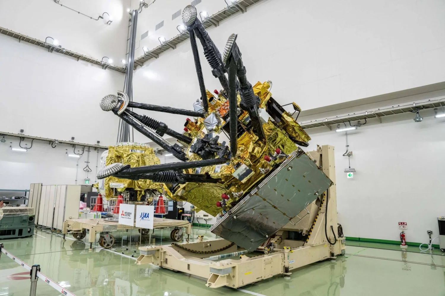 The propulsion module (back) and exploration and return modules (front), making up the Martian Moons eXploration (MMX) spacecraft, at the Tanegashima Space Center in Minamitane, Kagoshima Prefecture, on Aug. 13. | AFP-JIJI