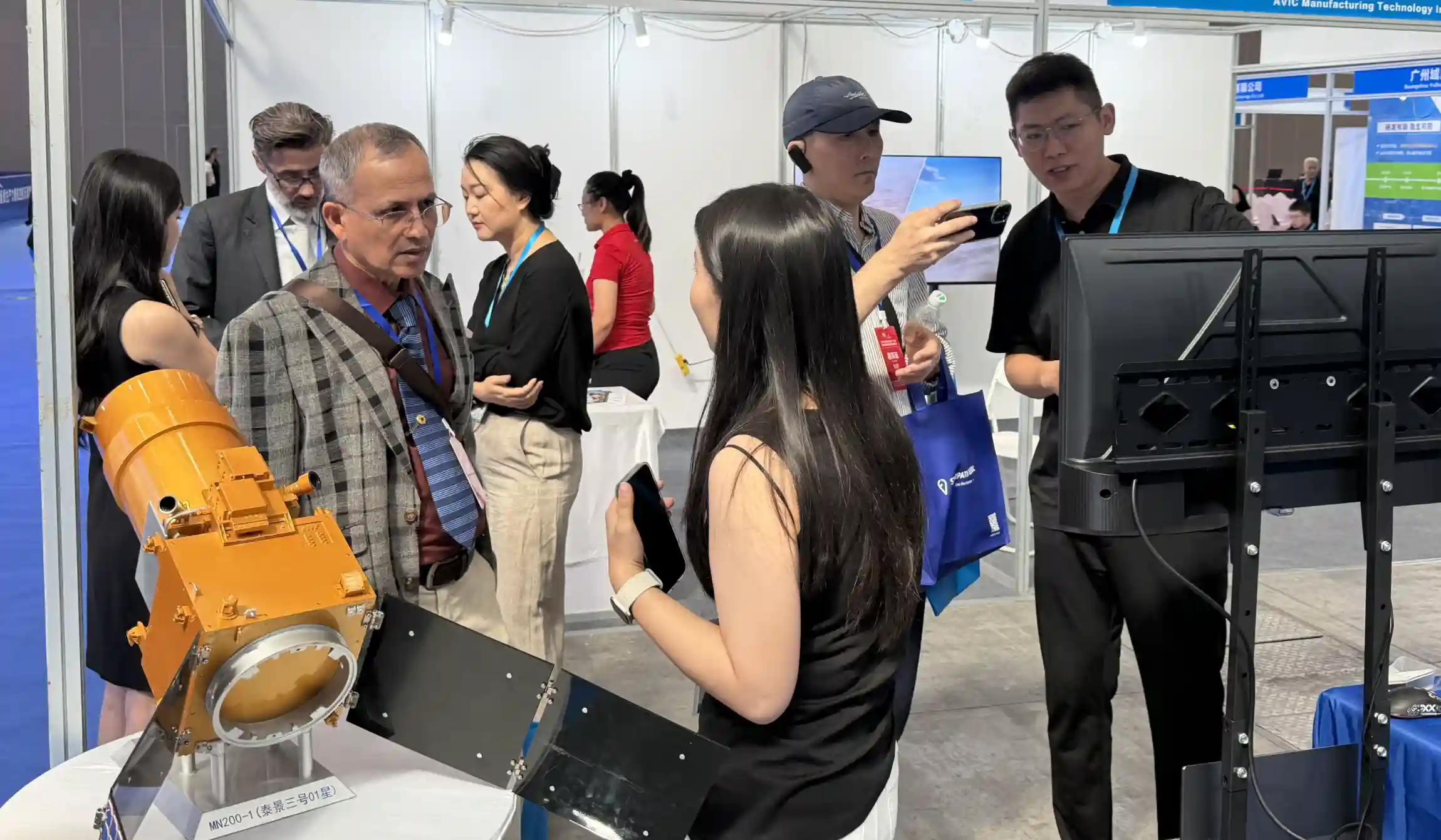 The STARPATH GLOBAL team discusses satellite remote sensing applications with overseas expo participants