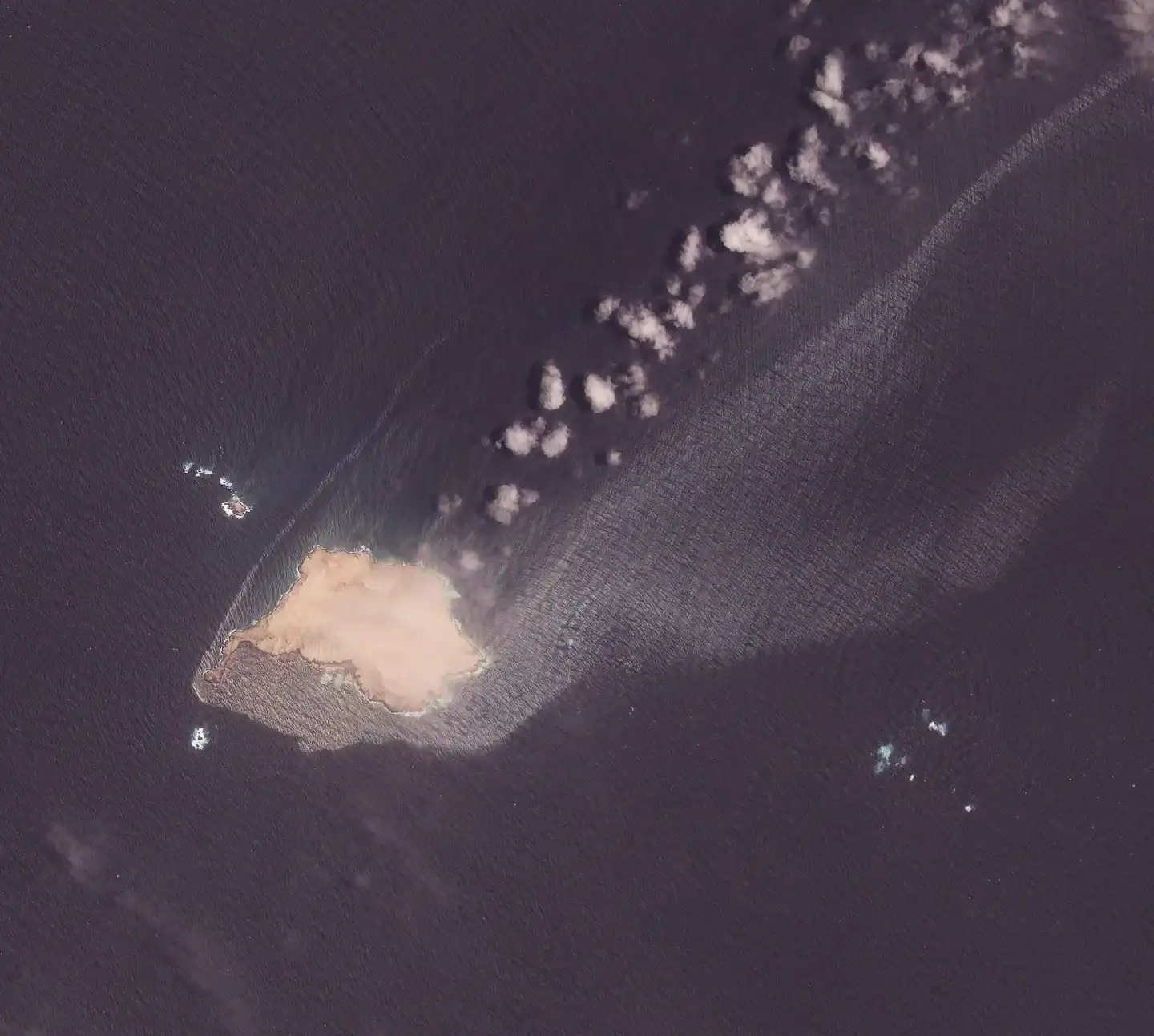 This satellite image from Planet Labs PBC shows crude oil leaking and spreading from the sanctioned Suezmax tanker Caroline Bezengi grounded at Qibliyah Island, off the coast of Oman,on Friday, July 31, 2026. (Planet Labs