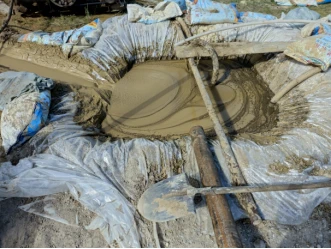 Impermeable geotextile laid in the mud-operation area