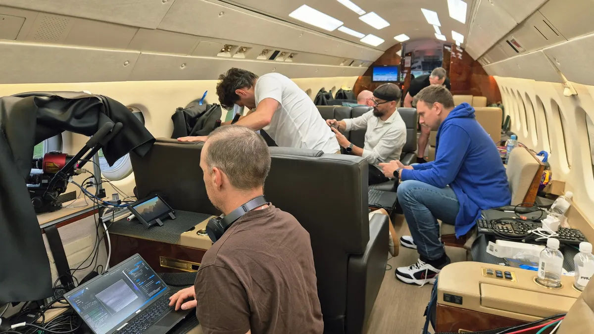 Researchers inside a private jet during a campaign observing the reentry of ESA's Cluster Tango satellite on Sept. 1, 2026. (Image credit: Jiří Šilha)