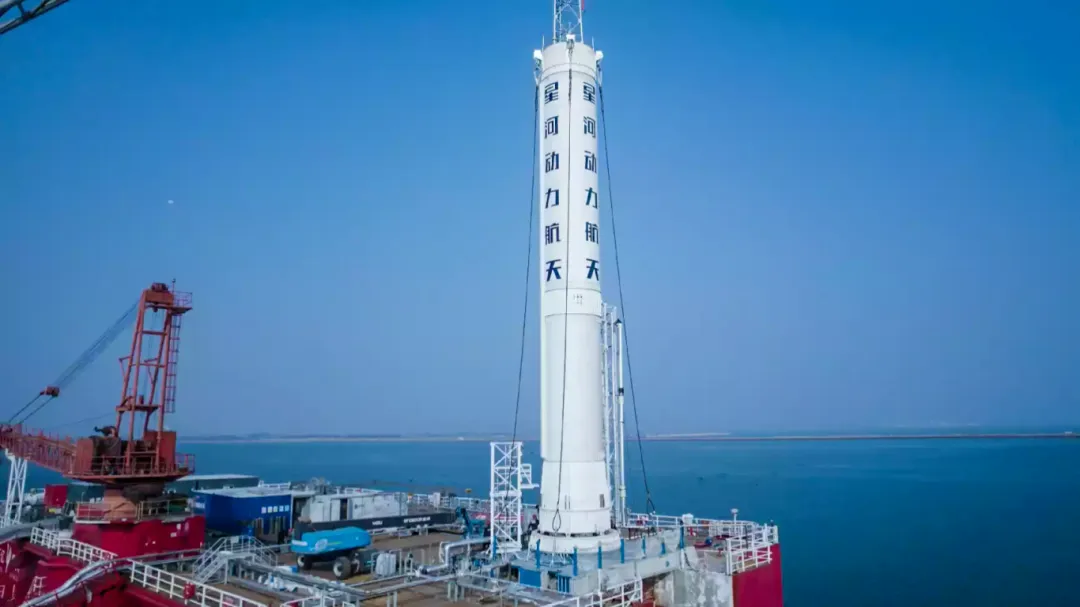 The PALLAS-1 first stage positioned on an offshore test platform. Image source Galactic Energy, November 19, 2025. This was a ground propulsion-system firing test, not an offshore recovery test.
